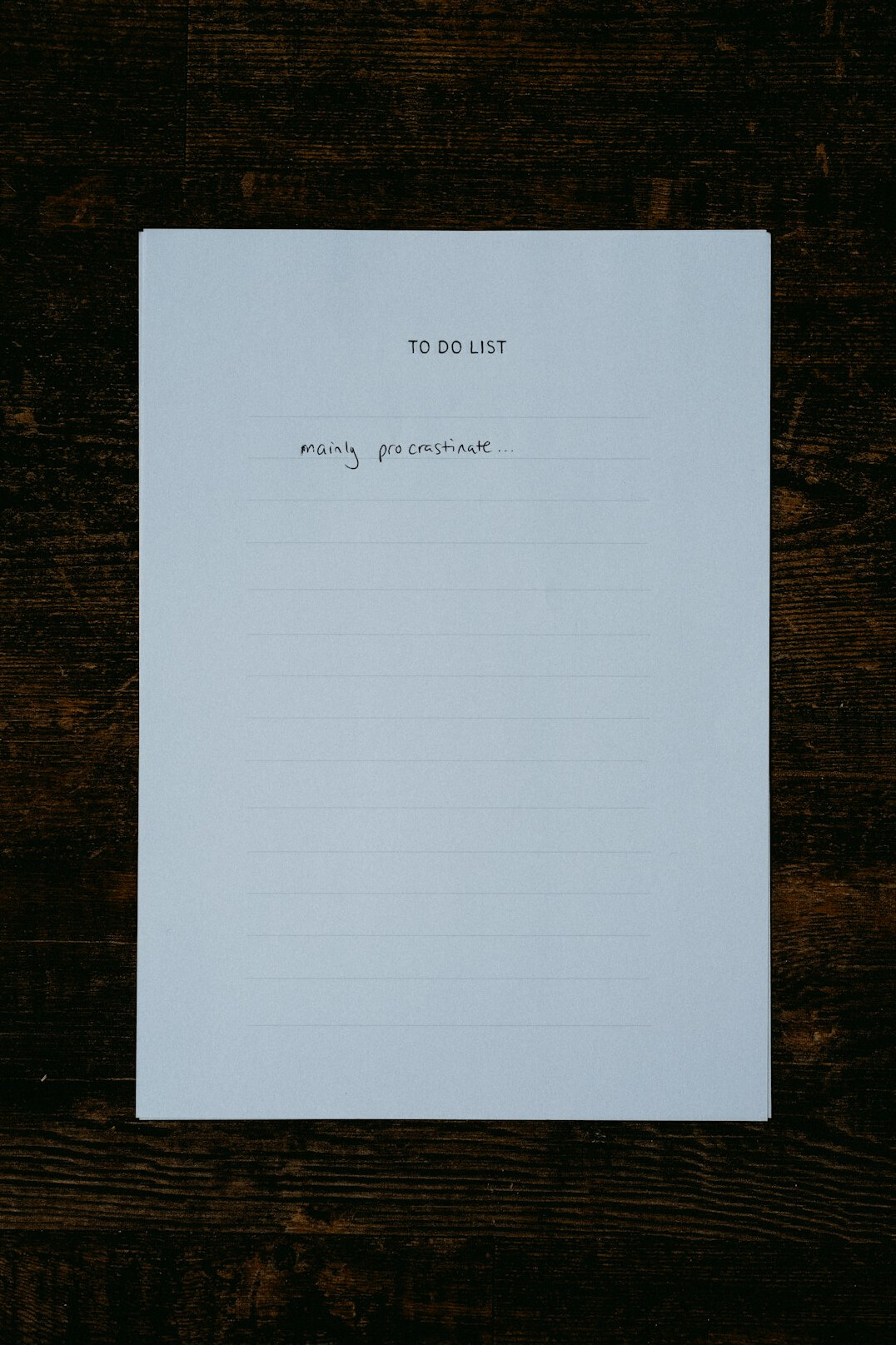 Notebook with a handwritten to-do list on a desk