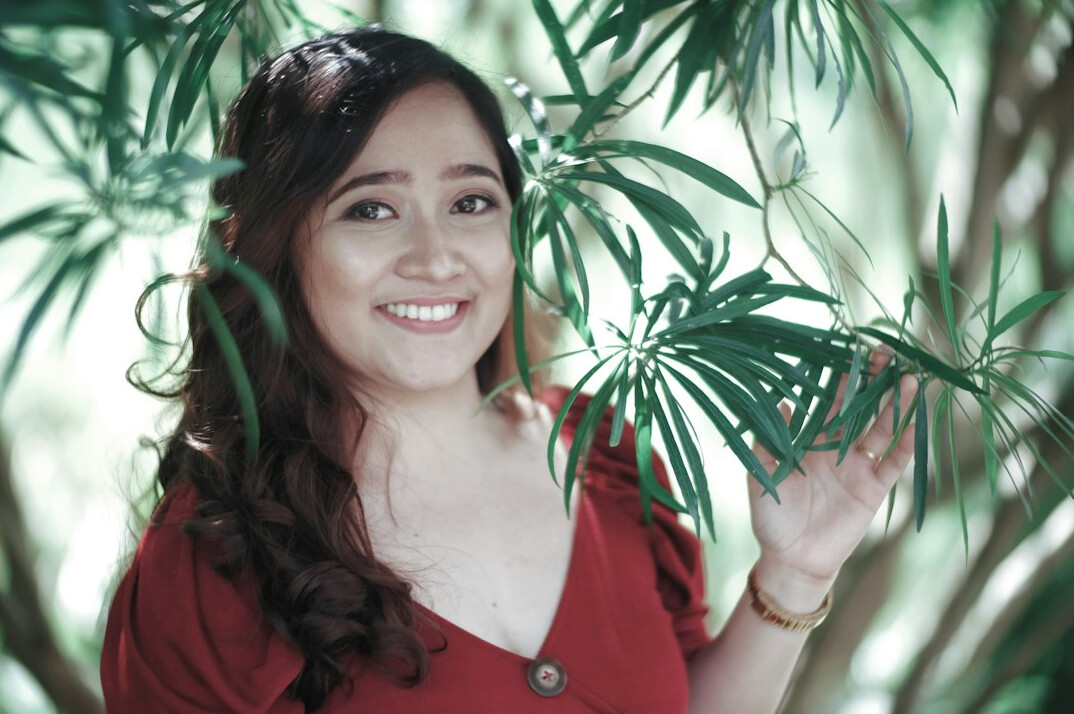 Confident woman smiling in a bright room