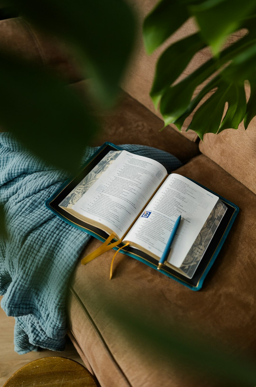 Open journal with handwritten notes and a pen